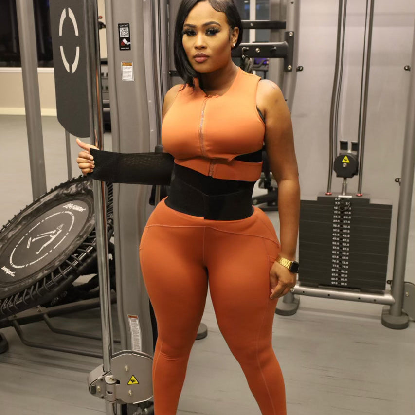 Woman in gym demonstrating waist trainer